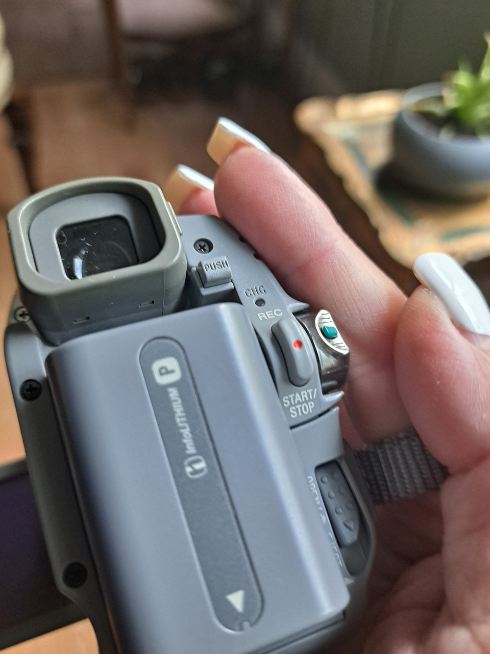 Sony Compact Gray Handheld Camcorder with Green Accent